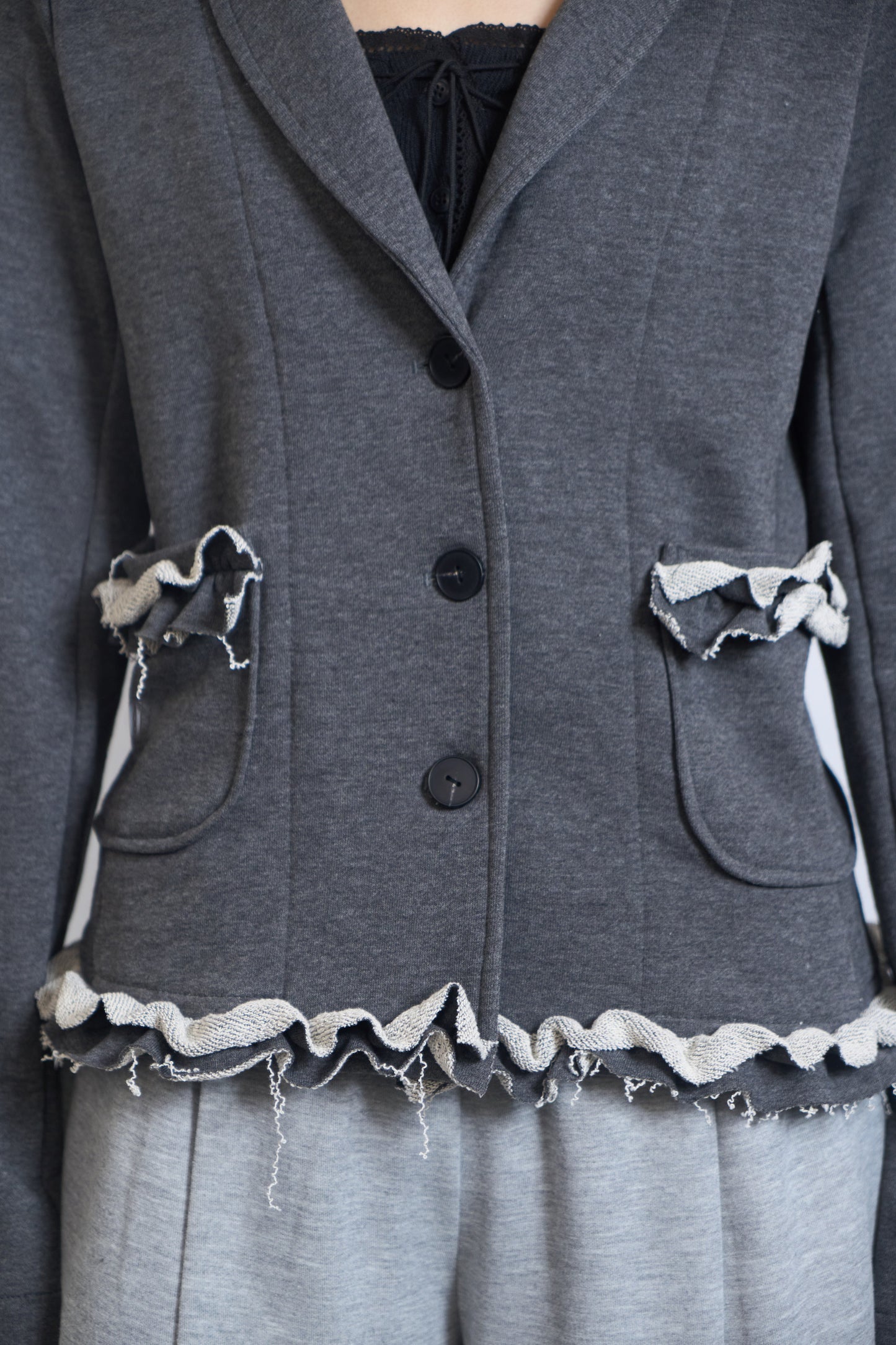 PLASTER JERSEY BLAZER WITH RAW RUFFLE TRIM