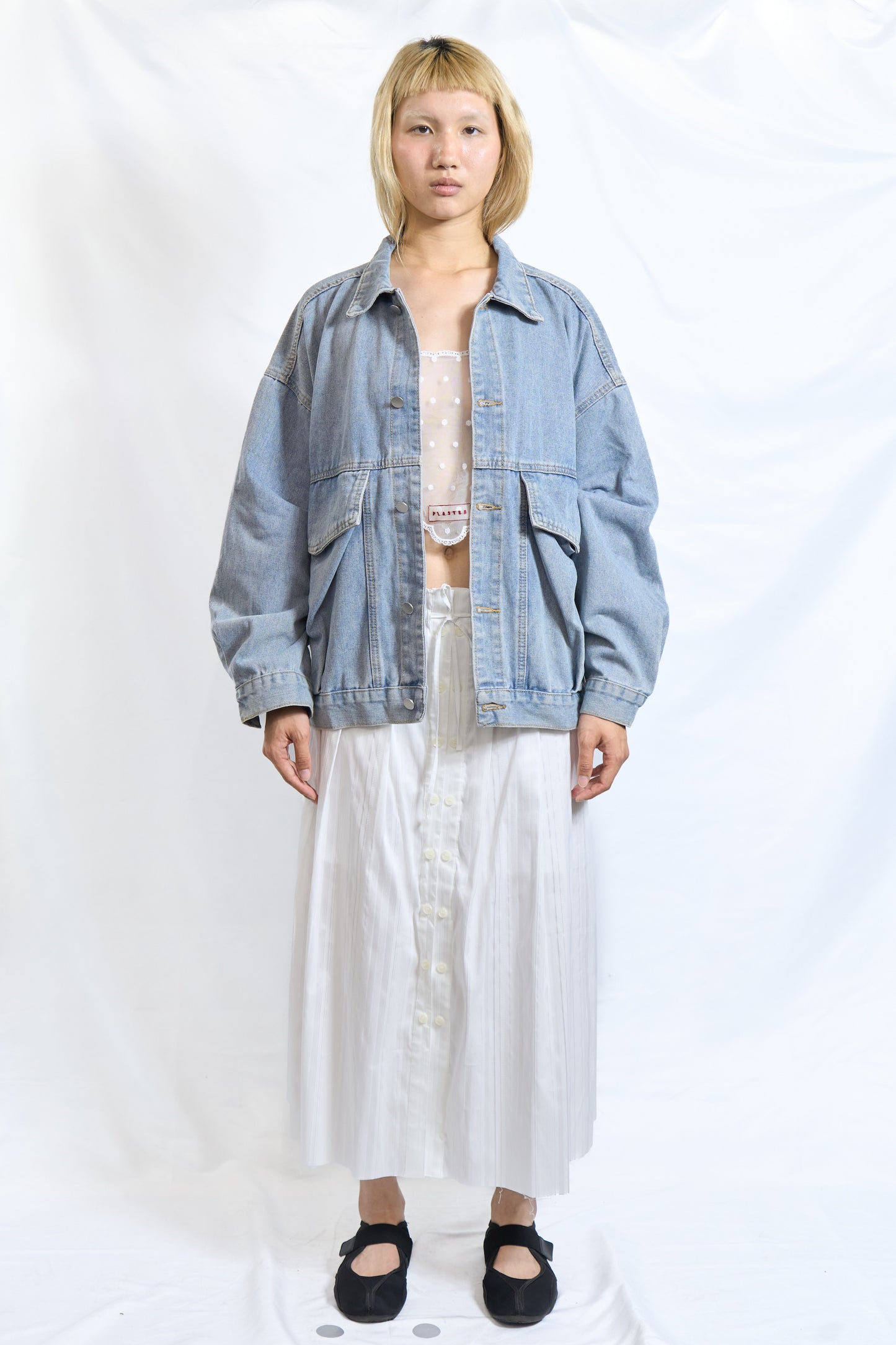 ASYMMETRIC BUTTON PLEATED SKIRT WHITE