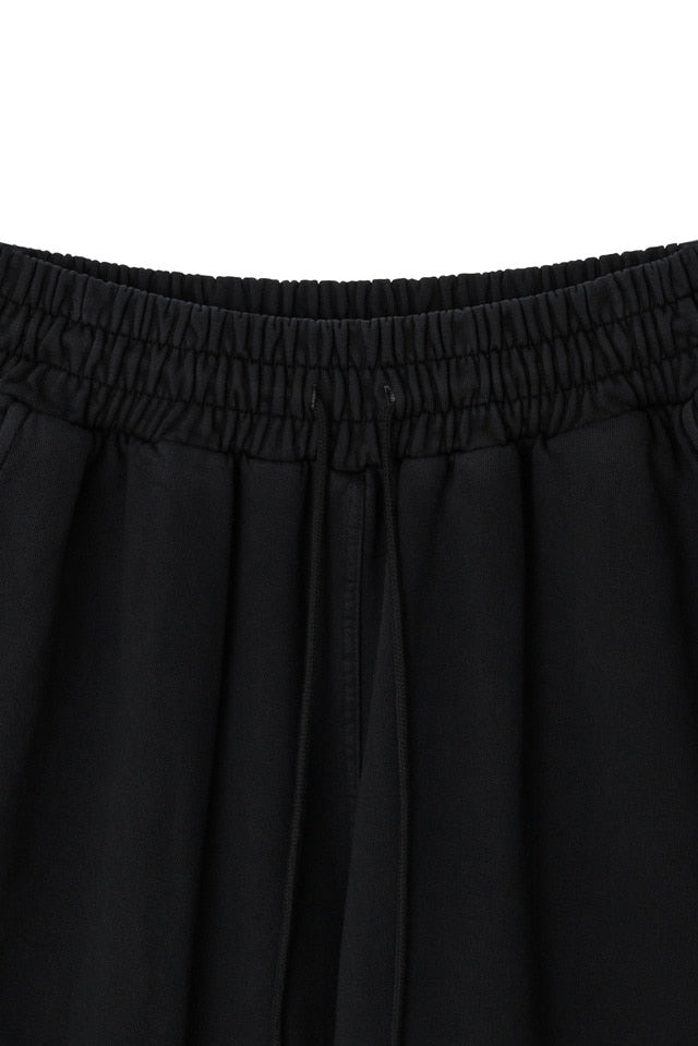 DYED CIRCLE LOGO OVER-FIT ARMOR SWEAT PANTS BLACK