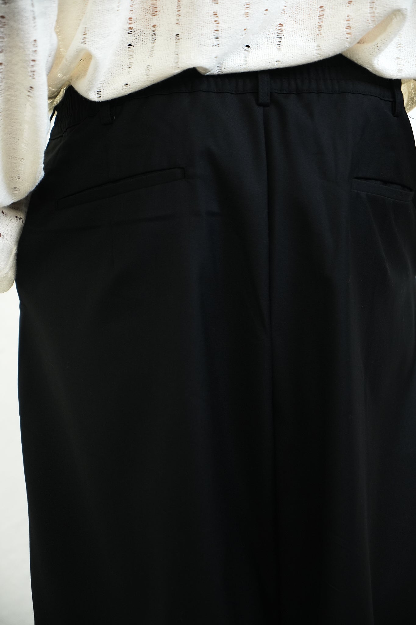 BLACK PLEATED TROUSERS